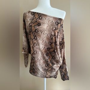 Stunning snake skin top for a night out with leather skinny pants